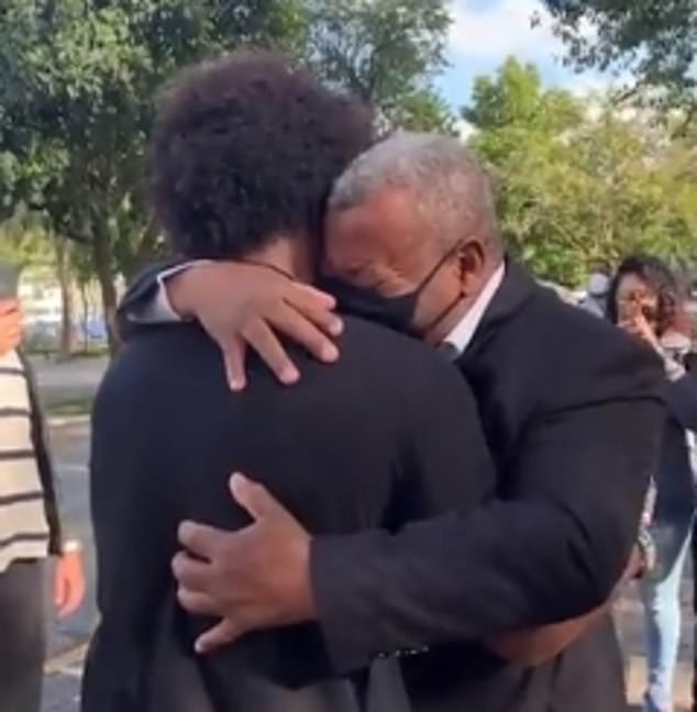 Willian embraces his father after returning home