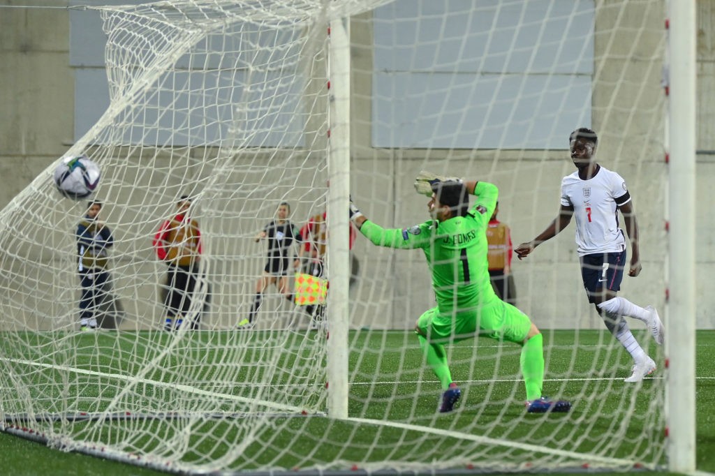 ANDORRA LA VELLA, ANDORRA: Bukayo Saka of England scores his team's second goal during the 2022 FIFA World Cup Qualifier match between Andorra and England at Estadi Nacional on October 09, 2021. (Photo by David Ramos/Getty Images)