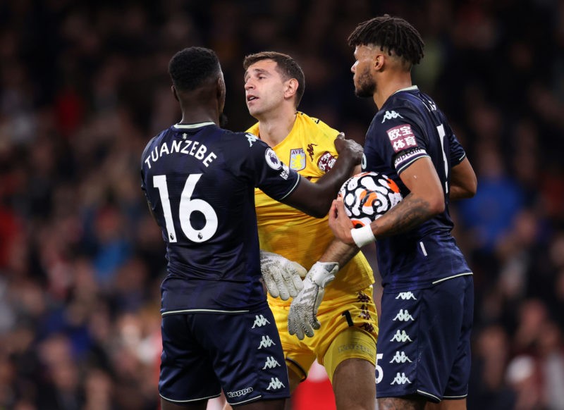 LONDON, ENGLAND - OCTOBER 22: Axel Tuanzebe and Tyrone Mings help up Emiliano Martinez of Aston Villa after they concede their second goal during t...