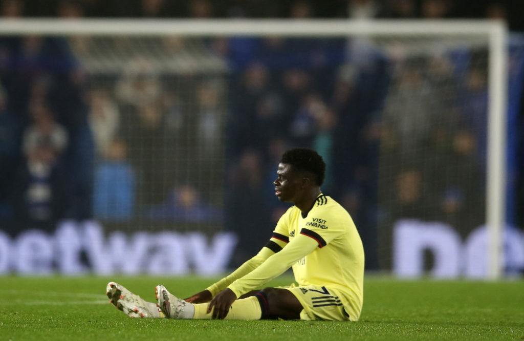 BRIGHTON, ENGLAND: Bukayo Saka of Arsenal suffers an injury during the Premier League match between Brighton & Hove Albion and Arsenal at American Express Community Stadium on October 02, 2021. (Photo by Steve Bardens/Getty Images)