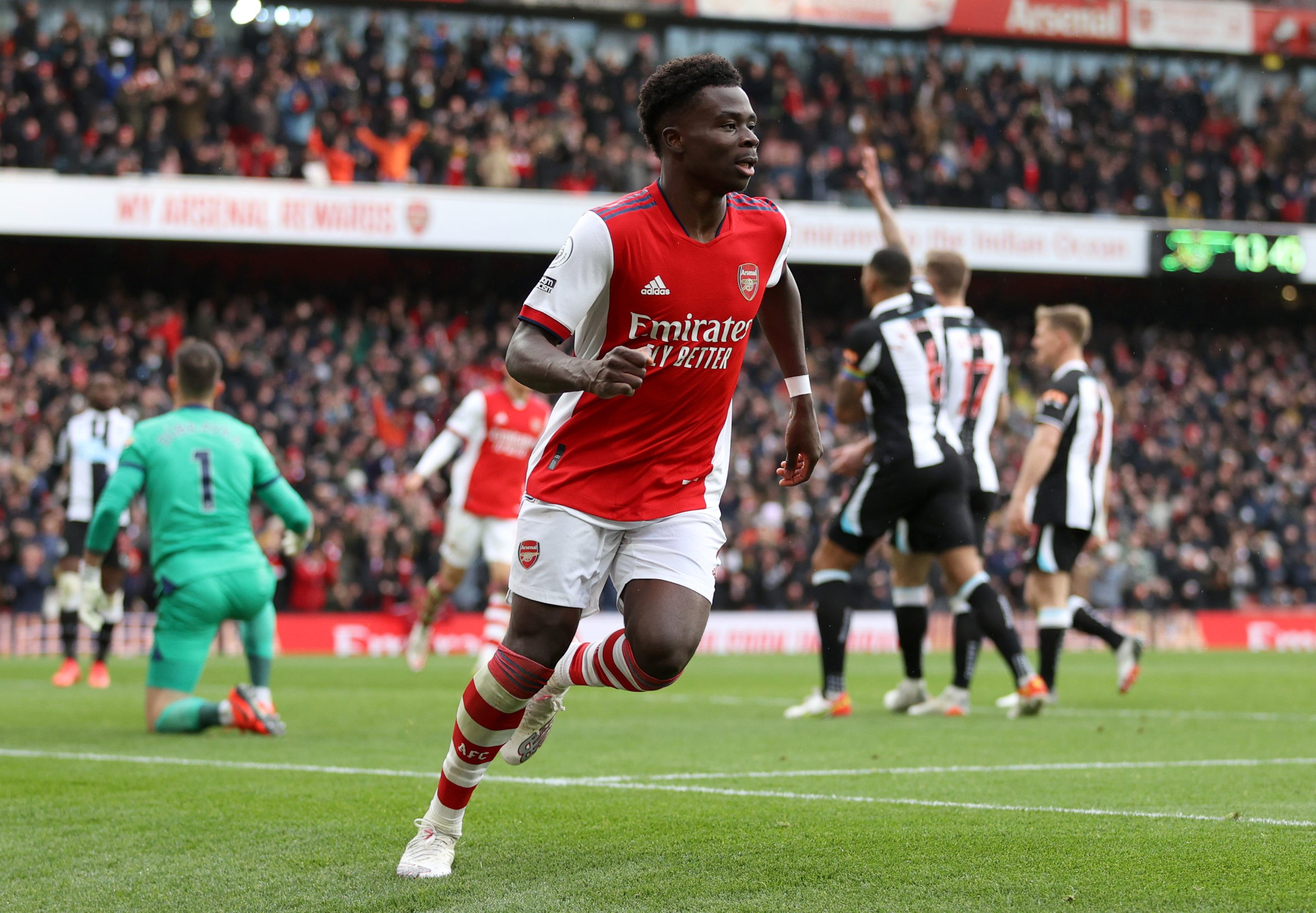 LONDON, ENGLAND: Bukayo Saka of Arsenal celebrates after scoring the team's first goal during the Premier League match between Arsenal and Newcastl...