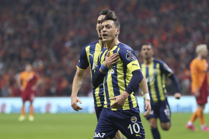 Mesut Ozil celebrates after scoring