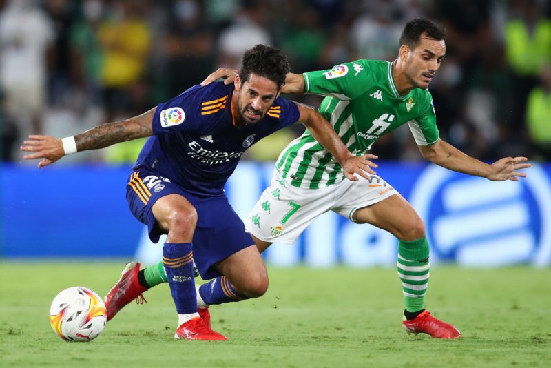 Have Arsenal really started talks to sign Real Madrid midfielder? 2 SEVILLE, SPAIN - AUGUST 28: Juanmi Jimenez of Real Betis and Isco of Real Madrid CF battle for the ball during the La Liga Santander match between Real Betis and Real Madrid CF at Estadio Benito Villamarin on August 28, 2021 in Seville, Spain. (Photo by Fran Santiago/Getty Images)