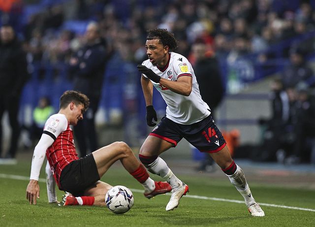 Xavier Amaechi playing for Bolton Wanderers (Photo via Amaechi on Instagram)