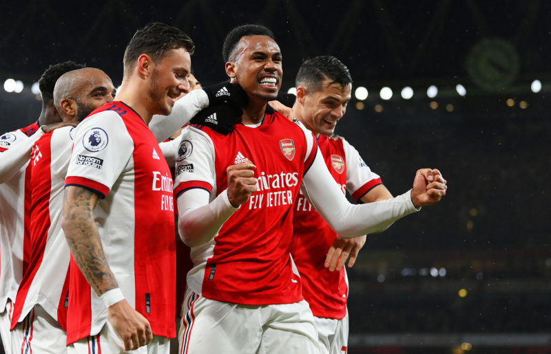 LONDON, ENGLAND - DECEMBER 11: Gabriel Magalhaes of Arsenal celebrates with teammates Ben White and Granit Xhaka after scoring their side's third g...