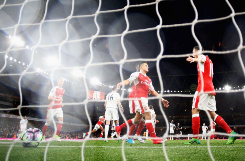 LONDON, ENGLAND - MAY 16: Alexis Sanchez of Arsenal celebrates scoring his sides second goal with Mesut Ozil of Arsenal during the Premier League m...