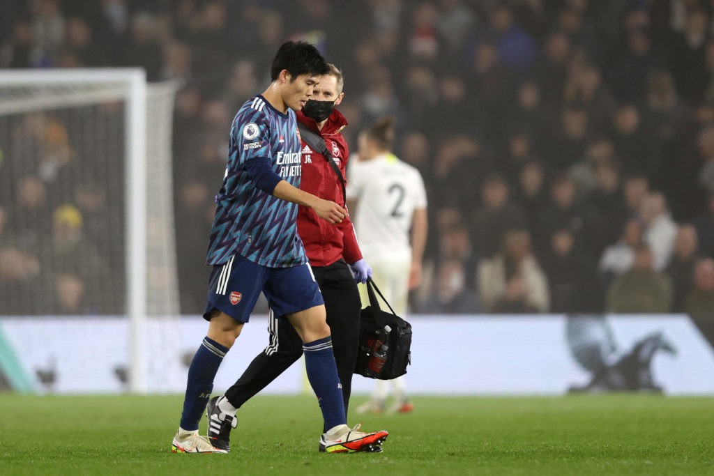 Takehiro Tomiyasu injury update ahead of Wolves 2 LEEDS, ENGLAND - DECEMBER 18: Takehiro Tomiyasu of Arsenal goes off injured during the Premier League match between Leeds United and Arsenal at Elland Road on December 18, 2021 in Leeds, England. (Photo by Naomi Baker/Getty Images)