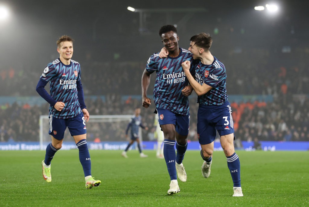LEEDS, ENGLAND: Bukayo Saka of Arsenal celebrates with Kieran Tierney after scoring their team's third goal during the Premier League match between Leeds United and Arsenal at Elland Road on December 18, 2021. (Photo by Naomi Baker / Getty Images)