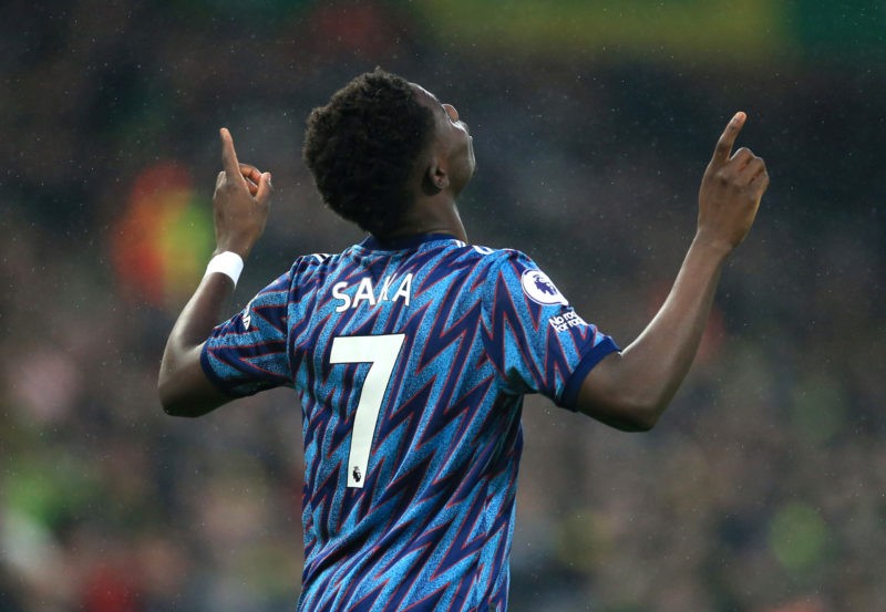 NORWICH, ENGLAND - DECEMBER 26: Bukayo Saka of Arsenal celebrates after scoring their team's first goal during the Premier League match between Nor...