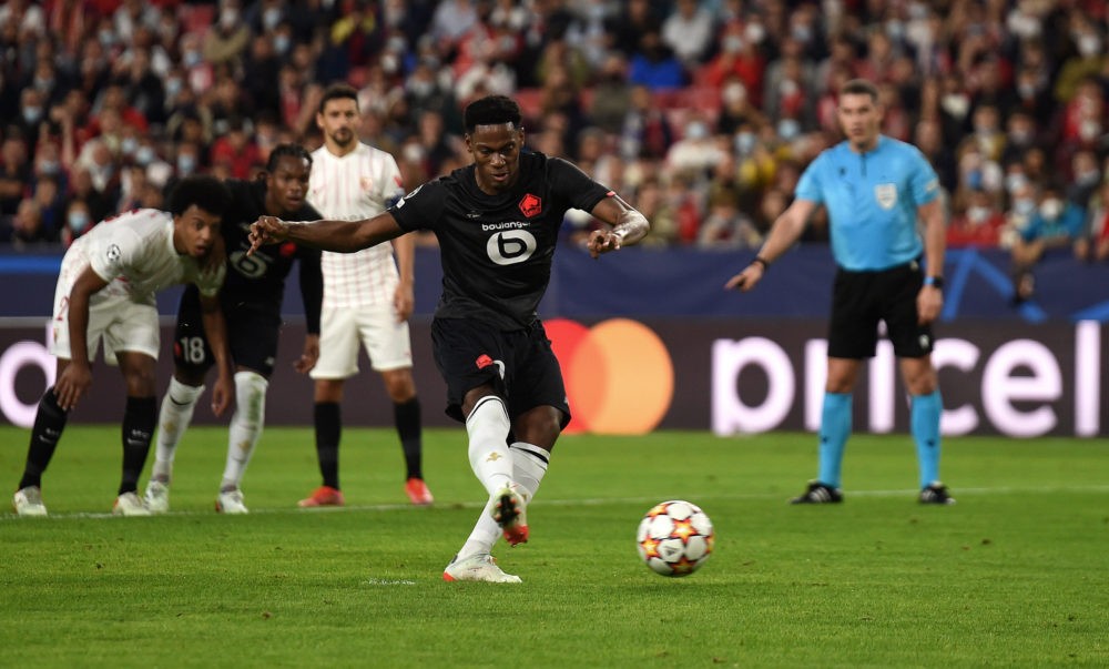 SEVILLE, SPAIN: Jonathan David of Lille OSC scores their team's first goal from the penalty spot during the UEFA Champions League group G match bet...