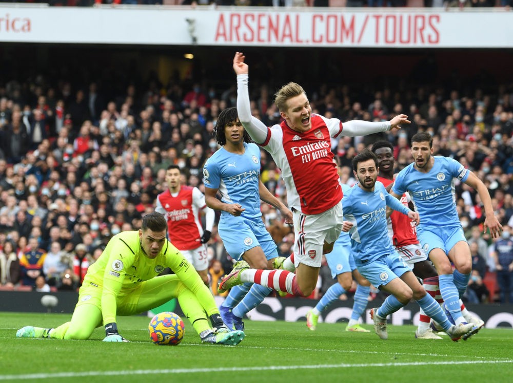 Martin Odegaard of Arsenal is fouled by Ederson of Manchester City (Photo via Stuart MacFarlane on Twitter)