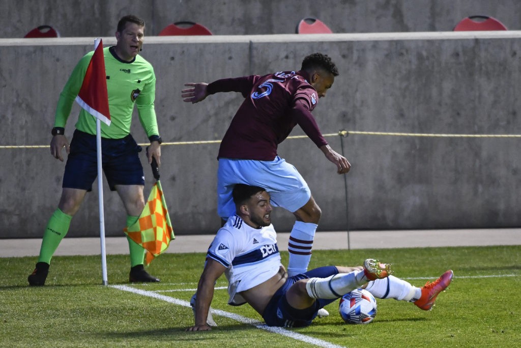 SANDY, UTAH - MAY 02: Lucas Cavallini #9 of Vancouver Whitecaps battles for the ball against Auston Trusty #5 of Colorado Rapids at Rio Tinto Stadium on May 02, 2021 in Sandy, Utah. (Photo by Alex Goodlett/Getty Images)