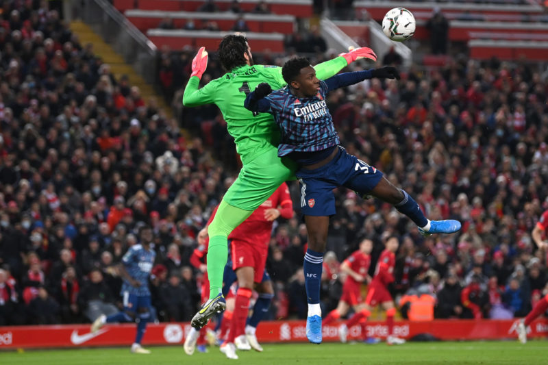 10-man Arsenal impress as they deny Liverpool 4 LIVERPOOL, ENGLAND - JANUARY 13: Eddie Nketiah of Arsenal is challenged by Alisson Becker of Liverpool during the Carabao Cup Semi Final First Leg match between Liverpool and Arsenal at Anfield on January 13, 2022 in Liverpool, England. (Photo by Michael Regan/Getty Images)