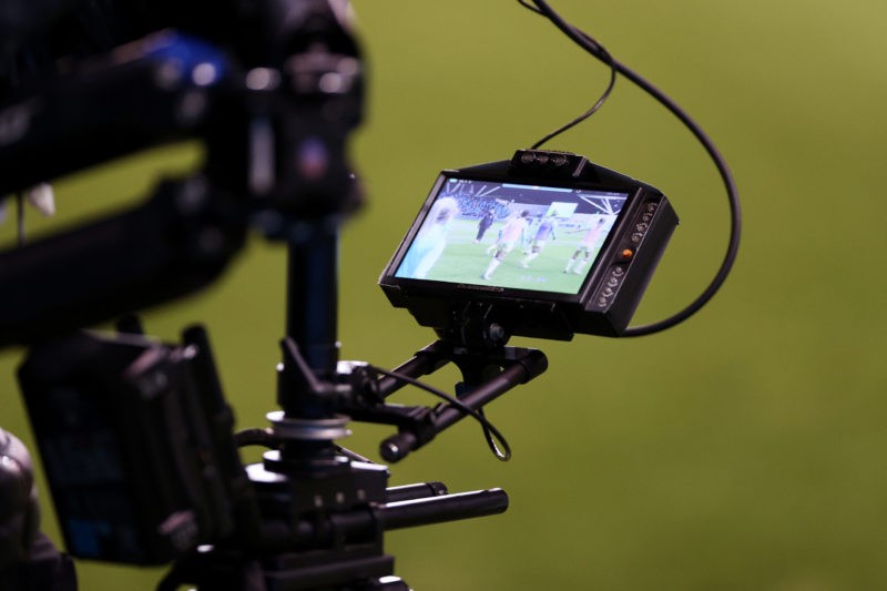 MANCHESTER, ENGLAND - JANUARY 23: A TV camera screen is seen as the players of Arsenal warm up prior to the Barclays FA Women's Super League match ...