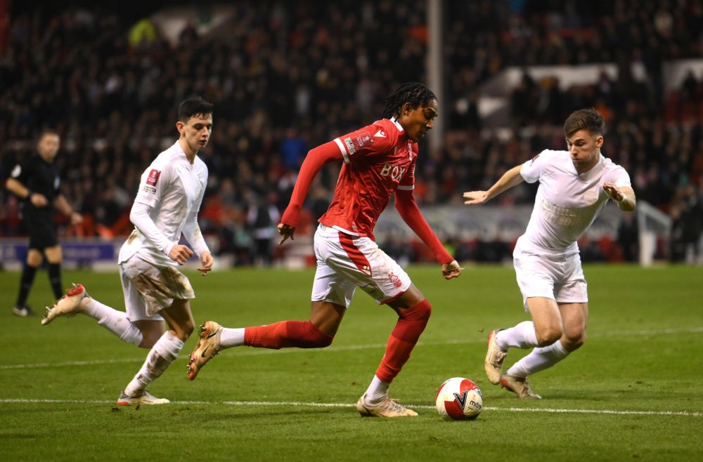 Exciting Arsenal 21yo right-back target available for bargain fee 4 NOTTINGHAM, ENGLAND: Djed Spence of Nottingham Forest runs with the ball whilst under pressure from Kieran Tierney of Arsenal during the Emirates FA Cup Third Round match between Nottingham Forest and Arsenal at City Ground on January 09, 2022. (Photo by Laurence Griffiths/Getty Images)