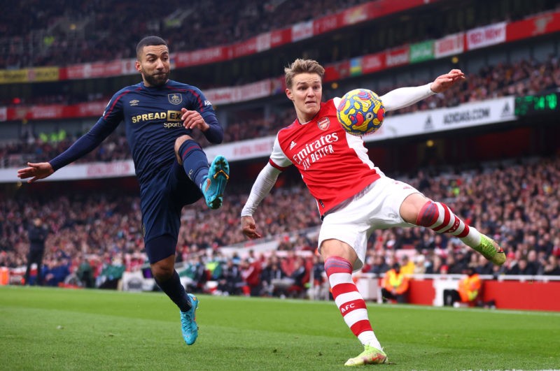 LONDON, ENGLAND - JANUARY 23: Martin Odegaard of Arsenal battles for possession with Aaron Lennon of Burnley during the Premier League match betwee...