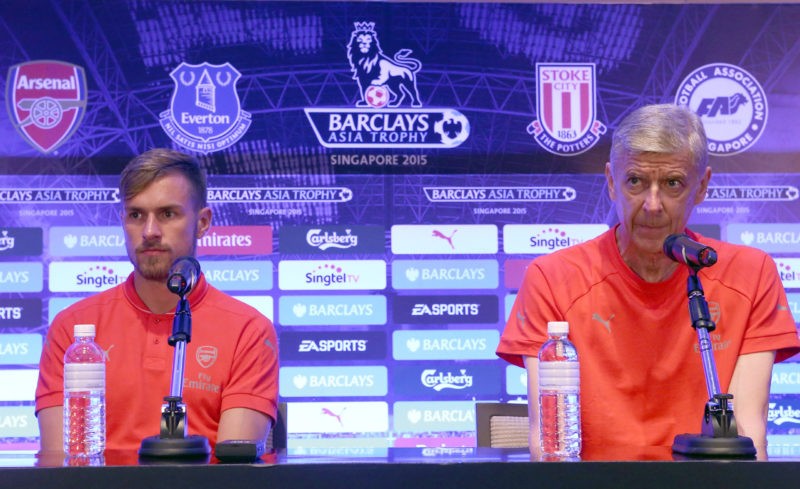 SINGAPORE - JULY 17: Arsene Wenger Manager of Arsenal speaks to the media while Aaron Ramsey looks on during a Barclays Asia Trophy press conferenc...