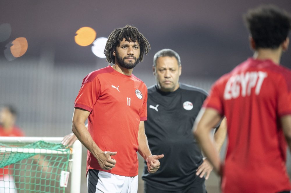 Egypt's midfielder Mohamed Elneny gives a thumbs up to Mohamed Salah during a training session at an annex of the Olembe stadium in Yaounde on Febr...