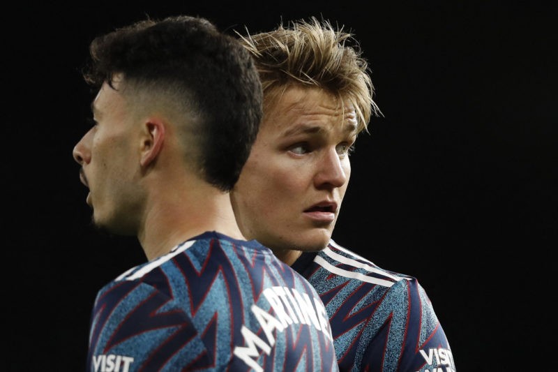 Arsenal's Brazilian striker Gabriel Martinelli (L) and Arsenal's Norwegian midfielder Martin Odegaard (R) line up to defend a freekick during the E...