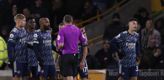 Arsenal's Brazilian striker Gabriel Martinelli (R) walks off having been shown two yellow cards in quick succession by English referee Michael Oliver during the English Premier League football match between Wolverhampton Wanderers and Arsenal at the Molineux stadium in Wolverhampton, central England on February 10, 2022. (Photo by ADRIAN DENNIS/AFP via Getty Images)