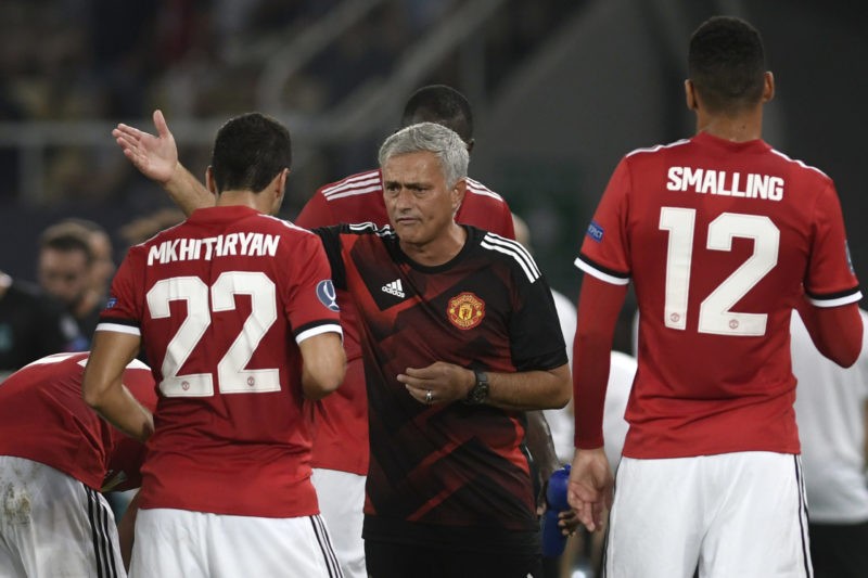 Manchester United's Portuguese manager Jose Mourinho (C) gives his instructions to Manchester United's Armenian midfielder Henrikh Mkhitaryan (L) d...