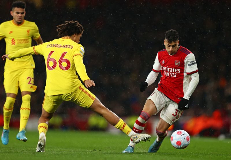 Gabriel Martinelli breaks Trent Alexander-Arnold 3 Arsenal's Brazilian striker Gabriel Martinelli (R) runs around Liverpool's English defender Trent Alexander-Arnold during the English Premier League football match between Arsenal and Liverpool at the Emirates Stadium in London on March 16, 2022. (Photo by ADRIAN DENNIS/AFP via Getty Images)