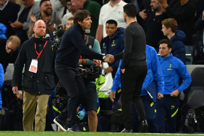Tottenham Hotspur's Italian head coach Antonio Conte (L) shakes hands with Arsenal's Spanish manager Mikel Arteta (R) after the English Premier Lea...