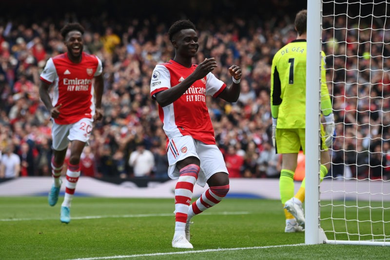 LONDON, ENGLAND - APRIL 23: Bukayo Saka of Arsenal celebrates after scoring their team's second goal from the penalty spot during the Premier Leagu...