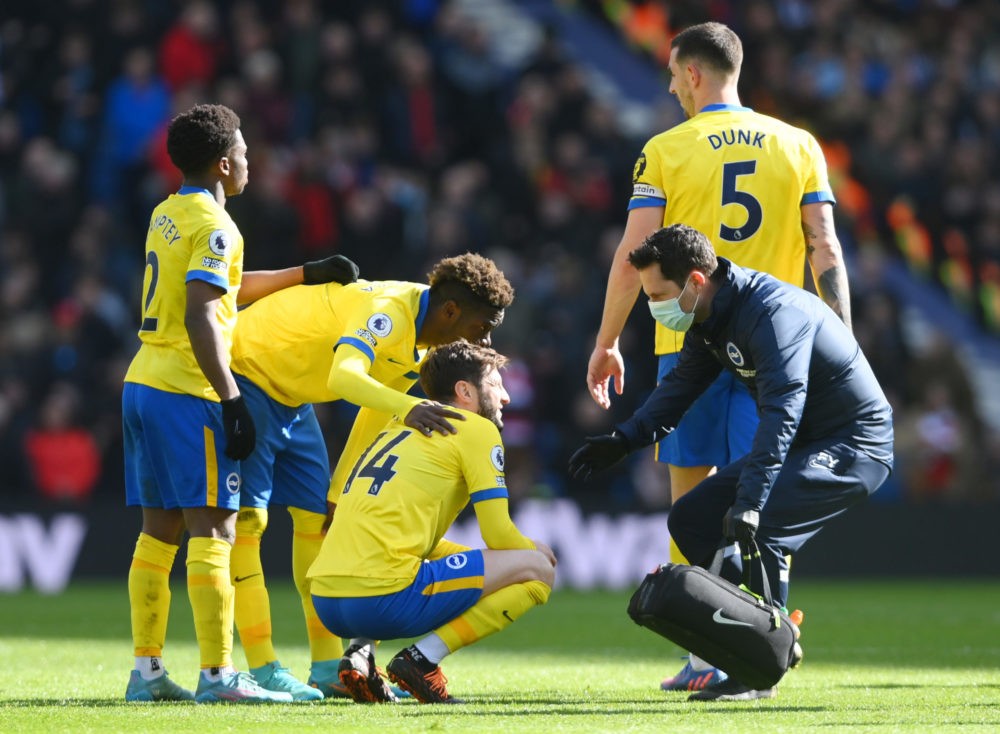 BRIGHTON, ENGLAND: Adam Lallana of Brighton & Hove Albion receives medical treatment during the Premier League match between Brighton & Hove Albion...