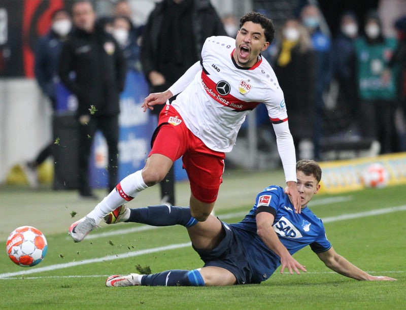 Stuttgarts's Egyptian forward Omar Marmoush (L) and Hoffenheim's German midfielder Dennis Geiger vie for the ball during the German first division Bundesliga football match TSG 1899 Hoffenheim v VfB Stuttgart in Sinsheim on February 25, 2022. (Photo by DANIEL ROLAND/AFP via Getty Images)