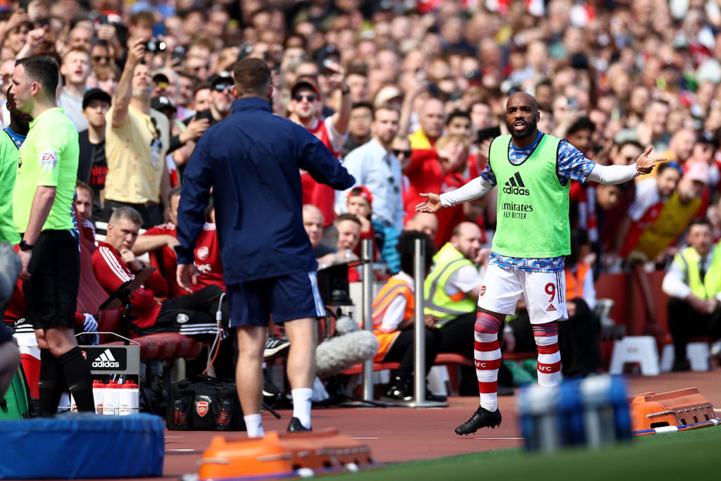 LONDON, ENGLAND: Alexandre Lacazette of Arsenal argues with a member of the backroom staff of Leeds United during the Premier League match between Arsenal and Leeds United at Emirates Stadium on May 08, 2022. (Photo by Ryan Pierse/Getty Images)
