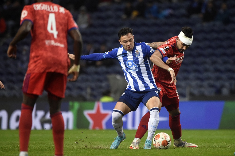 FC Porto's Brazilian forward Pepe Cossa (L) vies with Lyon's Brazilian midfielder Lucas Paqueta during the UEFA Europa League round of 16 first league football match between FC Porto and Olympique Lyonnais at the Dragao stadium in Porto on March 9, 2022. (Photo by MIGUEL RIOPA/AFP via Getty Images)