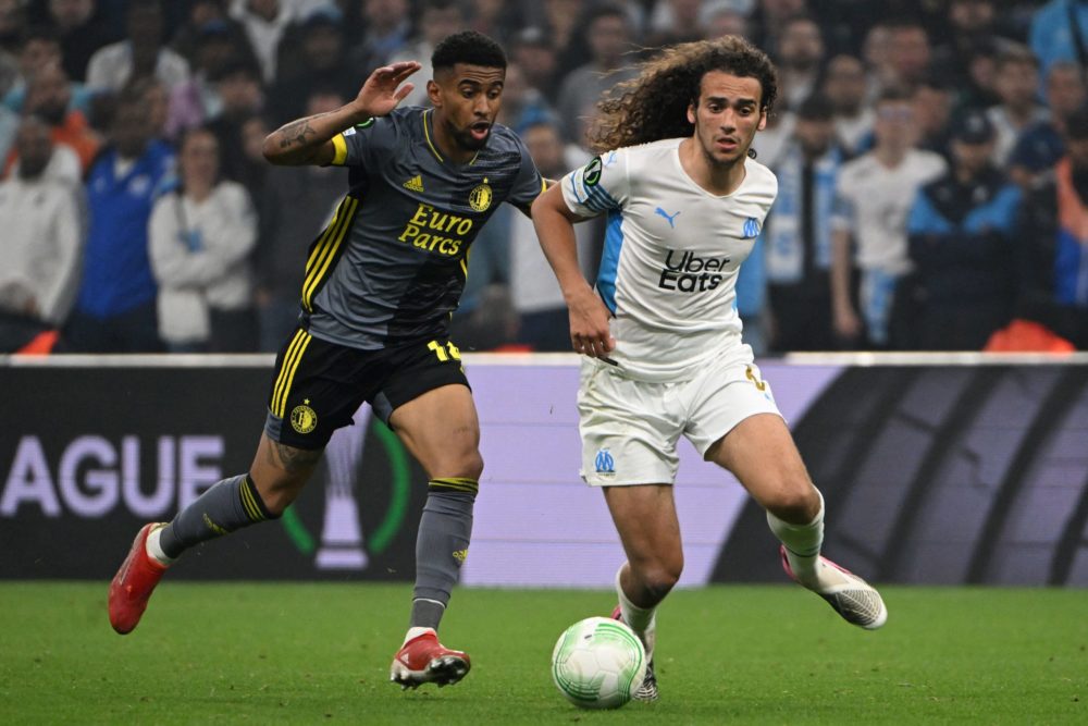 Feyenoord's Reiss Nelson (L) fights for the ball with Marseille's Matteo Guendouzi during the UEFA Europa Conference League semi-final second leg f...