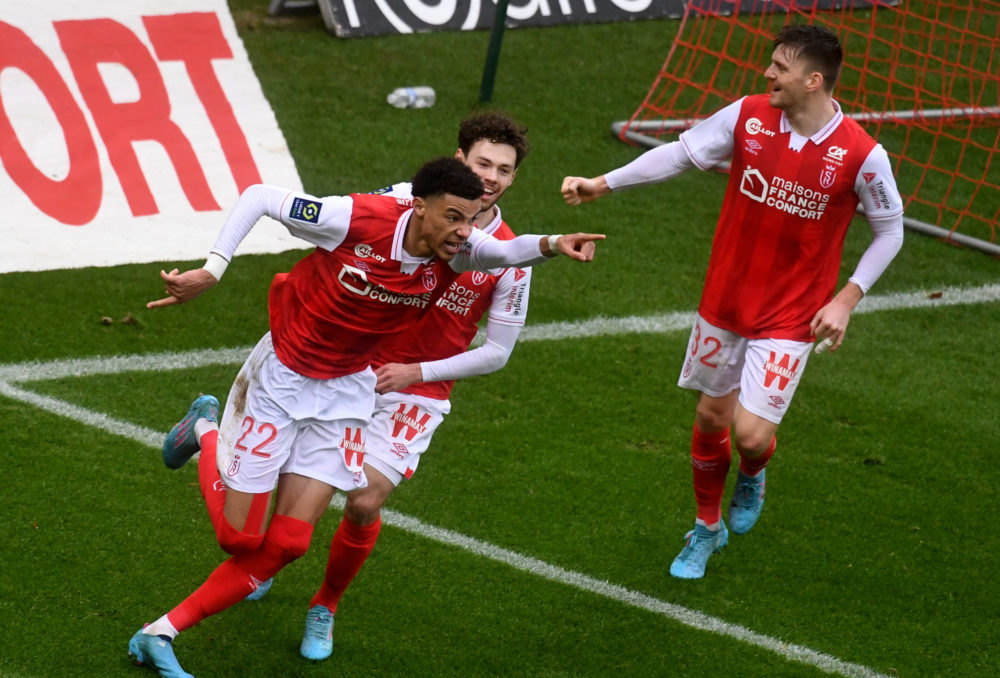 Reims French forward Hugo Ekitike (L) celebrates after scoring a goal during the French L1 football match Reims and Bordeaux at the Auguste Delaune...