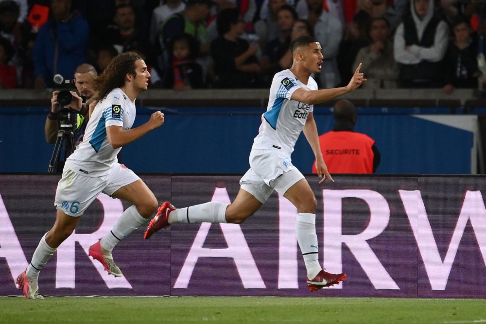 Marseille's French defender William Saliba (R) celebrates scoring his team's second goal - disallowed by the VAR - during the French L1 football ma...