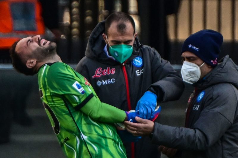 Real Madrid want former Arsenal keeper 2 Napoli's Colombian goalkeeper David Ospina (L) reacted while being treated for a hand injury during the Italian Serie A football match between Hellas Verona and Napoli on March 13, 2022 at the Marcantonio-Bentegodi stadium in Verona. (Photo by Miguel MEDINA / AFP)