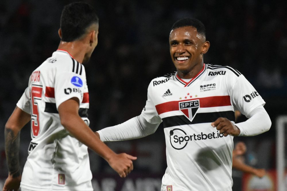 Brazil's Sao Paulo Marquinhos (R) celebrates with teammate Rodrigo Nestor after scoring the team's third goal against Bolivia's Jorge Wilstermann d...