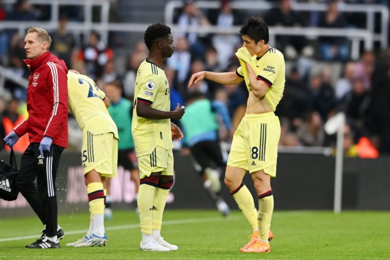 NEWCASTLE UPON TYNE, ENGLAND - MAY 16: Takehiro Tomiyasu of Arsenal (R) interacts with teammate Bukayo Saka as he is substituted off following an i...
