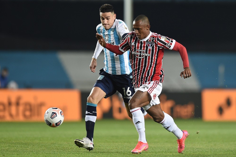 AVELLANEDA, ARGENTINA: Mauricio Martinez of Racing Club and Marquinhos of Sao Paulo fight for the ball during a round of sixteen second leg match b...