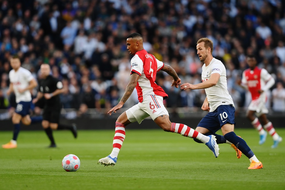 LONDON, ENGLAND: Gabriel Magalhaes of Arsenal battles for possession with Harry Kane of Tottenham Hotspur during the Premier League match between T...