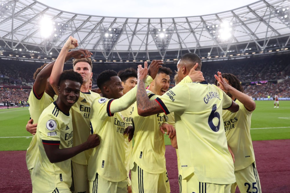LONDON, ENGLAND: Gabriel of Arsenal celebrates scoring their side's second goal with teammates during the Premier League match between West Ham Uni...