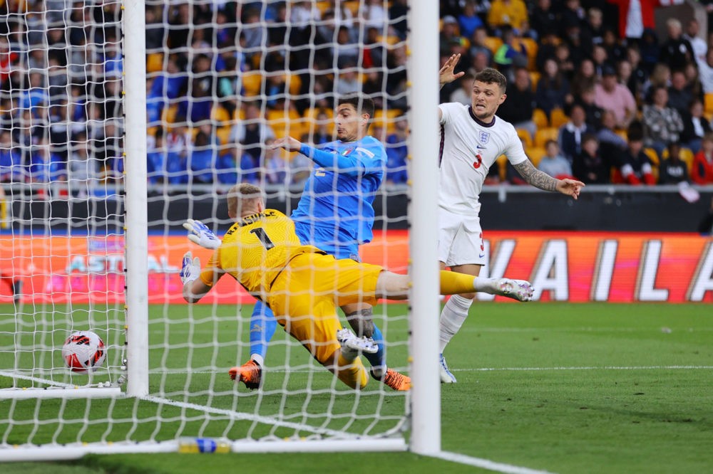 WOLVERHAMPTON, ENGLAND: Aaron Ramsdale makes a save from Giovanni Di Lorenzo of Italy as Kieran Trippier of England looks on during the UEFA Nation...