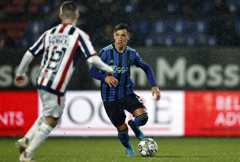 Ajax' Argentine defender Lisandro Martinez (C) runs with the ball during the Dutch Eredivisie football match between Willem II and Ajax at the Koning Willem II stadium in Tilburg, southern Netherlands, on February 19, 2022. (Photo by MAURICE VAN STEEN/ANP/AFP via Getty Images)