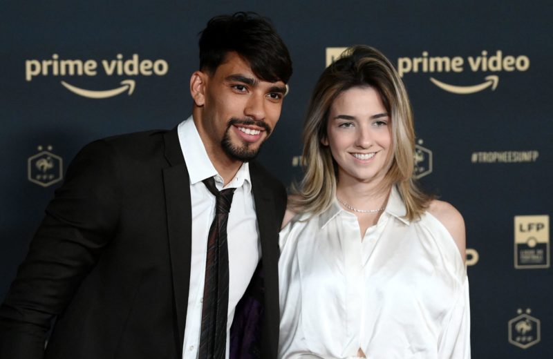 Lyons Brazilian midfielder Lucas Paqueta and his partner pose ahead of the TV show on May 15, 2022 in Paris, as part of the 30th edition of the UNF...