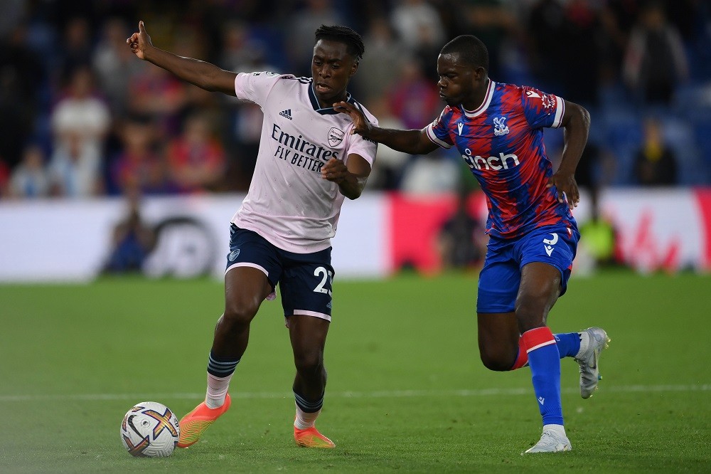 LONDON, ENGLAND: Albert Sambi Lokonga of Arsenal is challenged by Tyrick Mitchell of Crystal Palace during the Premier League match between Crystal...