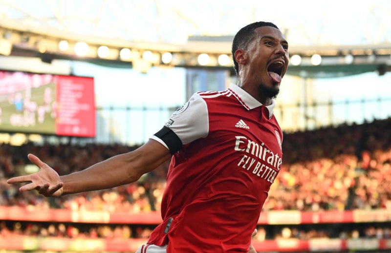Arsenal's French defender William Saliba celebrates as Arsenal's Brazilian defender Gabriel Magalhaes scores during the English Premier League foot...