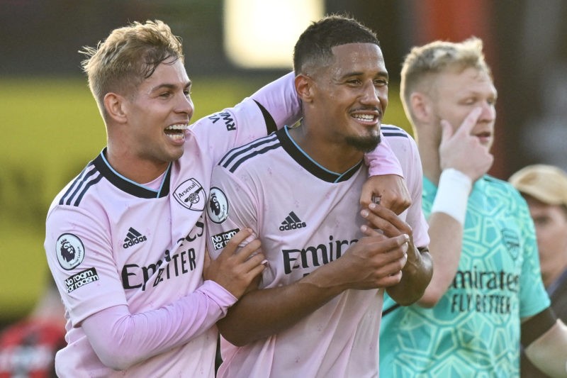 Arsenal's English midfielder Emile Smith Rowe (L) and Arsenal's French defender William Saliba celebrate after winning at the end of the English Pr...