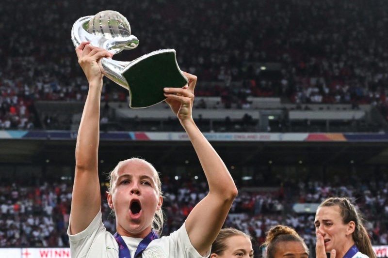 England's striker Beth Mead holds up the trophy as England's players celebrate after their win in the UEFA Women's Euro 2022 final football match between England and Germany at the Wembley stadium, in London, on July 31, 2022. - England won a major women's tournament for the first time as Chloe Kelly's extra-time goal secured a 2-1 victory over Germany at a sold out Wembley on Sunday. - No use as moving pictures or quasi-video streaming. Photos must therefore be posted with an interval of at least 20 seconds. (Photo by JUSTIN TALLIS / AFP) / No use as moving pictures or quasi-video streaming. Photos must therefore be posted with an interval of at least 20 seconds. (Photo by JUSTIN TALLIS/AFP via Getty Images)