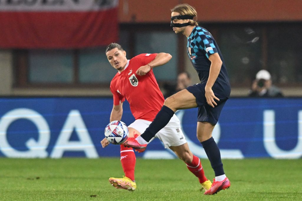 Austria's midfielder Marcel Sabitzer (L) and Croatia's midfielder Lovro Majer vie for the ball during the UEFA Nations League, league A, Group 1 football match between Austria and Croatia in Vienna, Austria, on September 25, 2022. (Photo by JOE KLAMAR/AFP via Getty Images)
