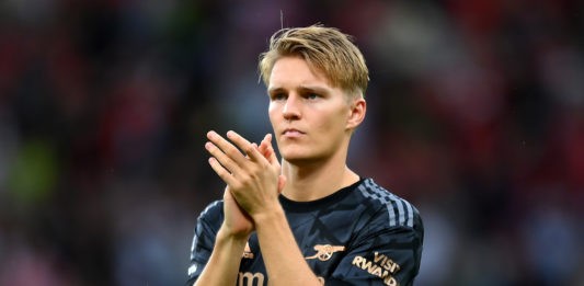 MANCHESTER, ENGLAND - SEPTEMBER 04: Martin Oedegaard of Arsenal applauds fans after the Premier League match between Manchester United and Arsenal FC at Old Trafford on September 04, 2022 in Manchester, England. (Photo by Shaun Botterill/Getty Images)
